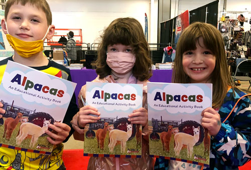 kids holding their prize after completing the scavenger hunt